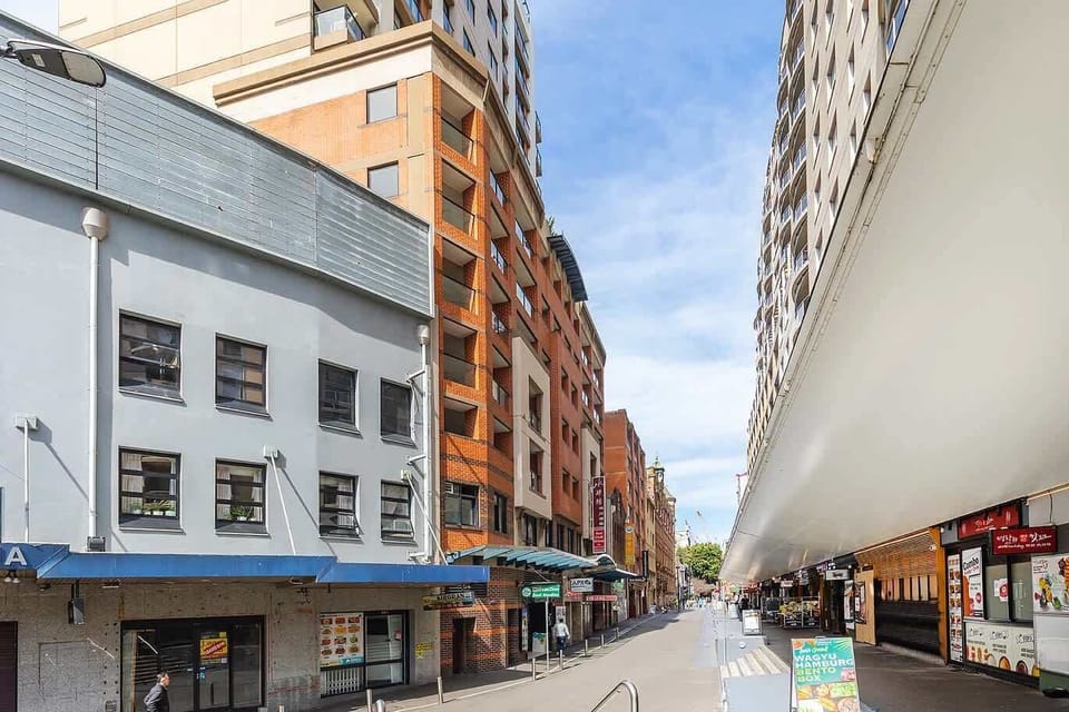 Historic building façades along a busy commercial street.