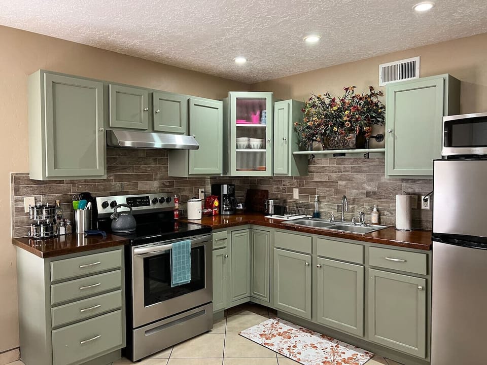 Fully Stocked Kitchen - Cabinet Space, Counter Space, Spices, Modern Appliances: Oven/Stovetop, Microwave, Fridge, and Coffee Machine