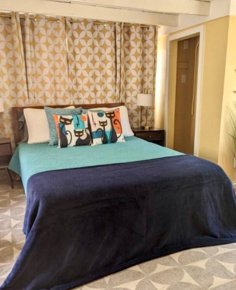 Bedroom - Studio Style, Queen Bed, Seating, and Closets on Both Sides of the Room