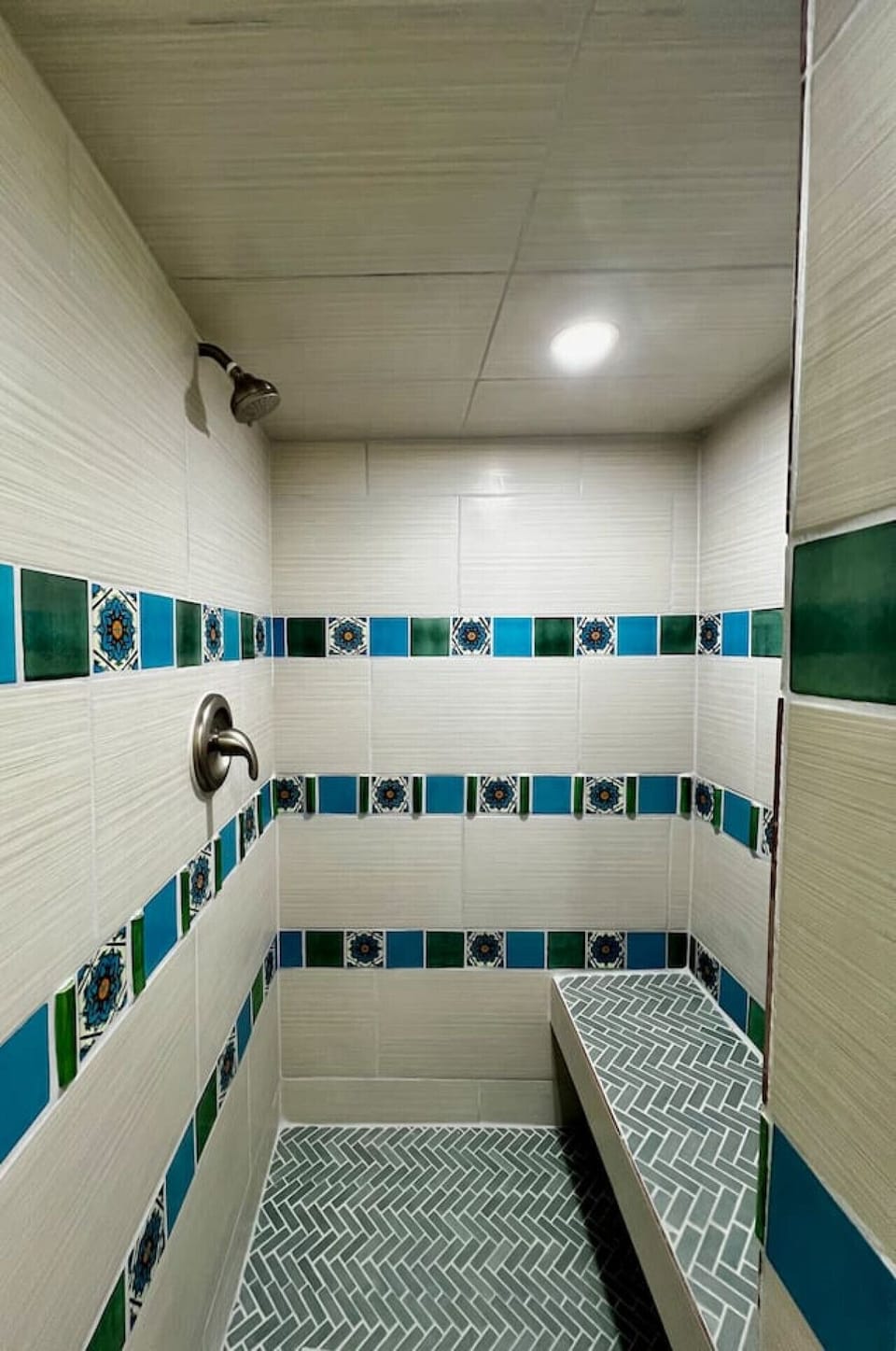 Bathroom - Custom Talavera Tiled Shower, Seat in Shower, and Complimentary Amenities: Shampoo, Conditioner, and Body Wash