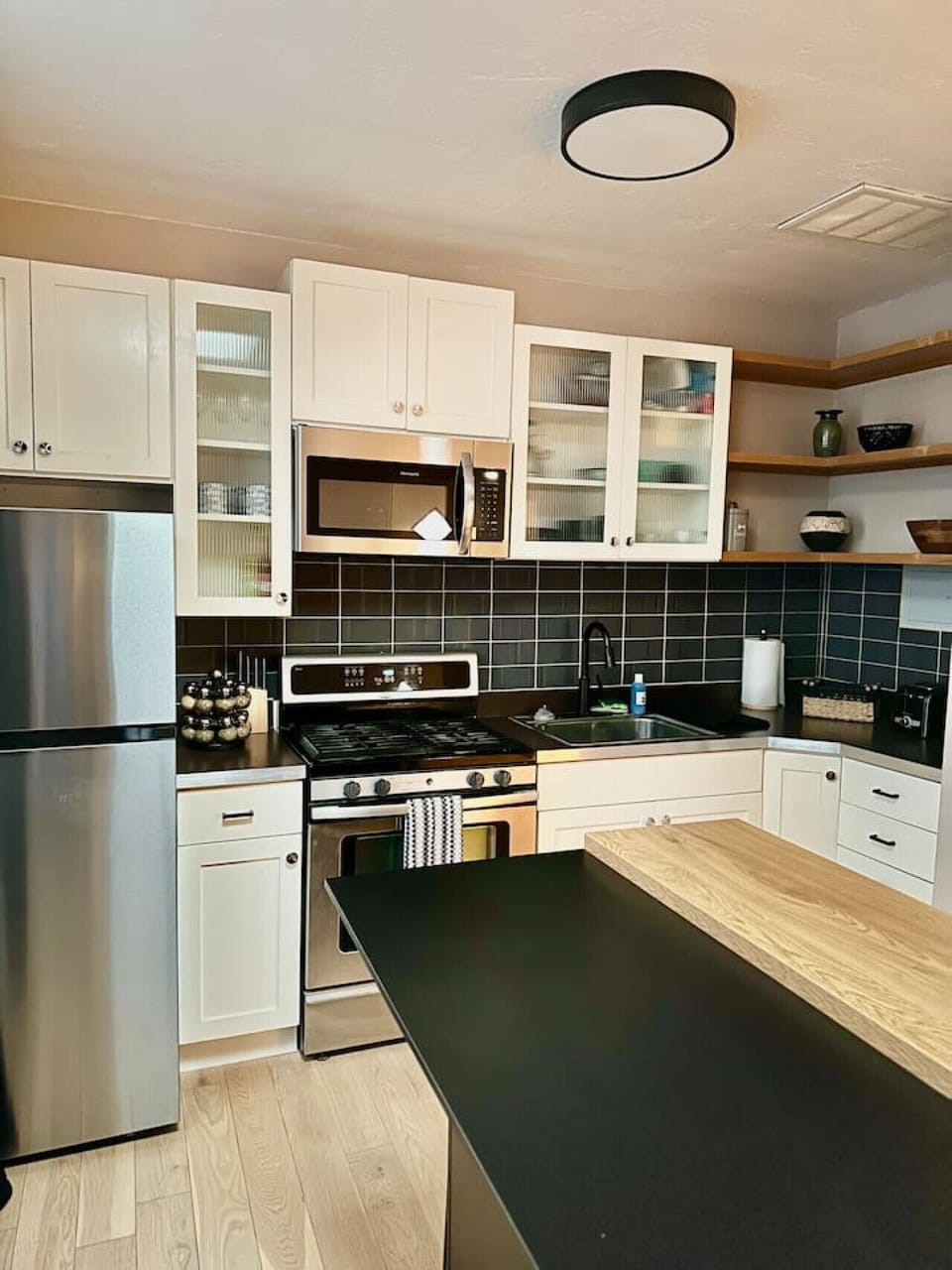 Kitchen - Modern Appliances, Island Seating, and Cabinet Space