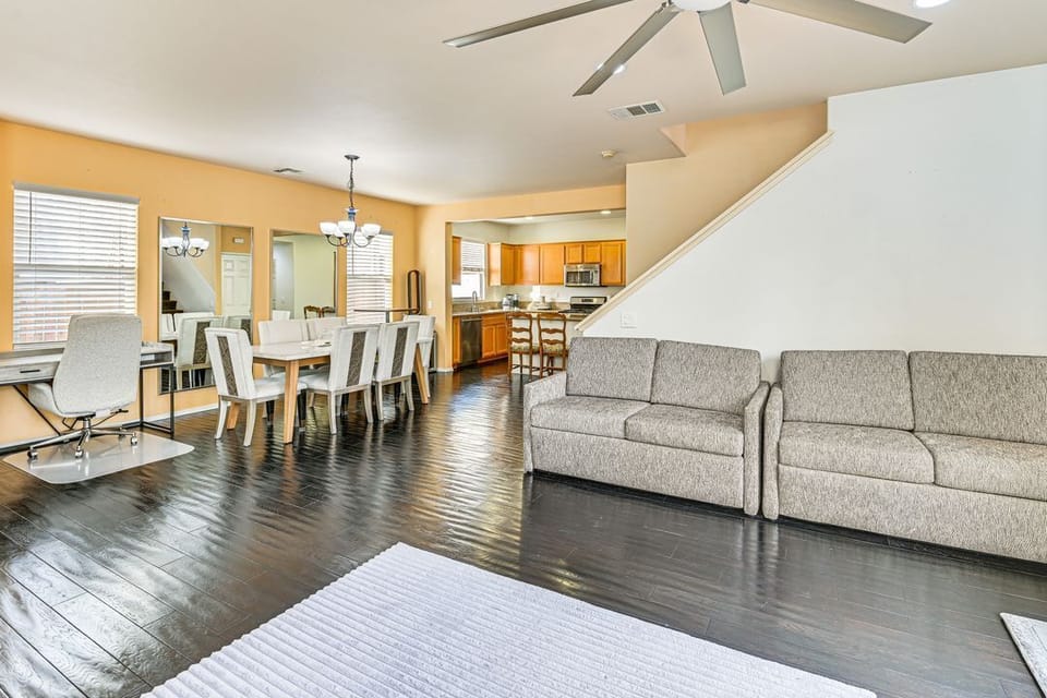 Living room, Dining room, computer desk, and kitchen area.