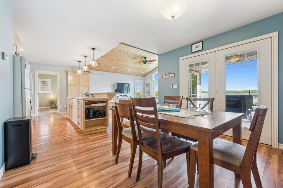 Bright dining area with lake views, open to the kitchen and living space for easy entertaining.