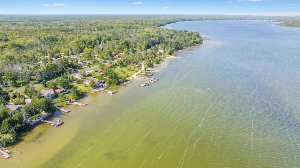 Crystal-clear, spring-fed Miller Lake — excellent for swimming, boating, and peaceful mornings on the dock.