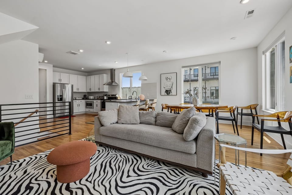 Living Room: Bright and comfortable living area featuring a cozy couch and smart TV, perfect for movie nights or quiet downtime.
