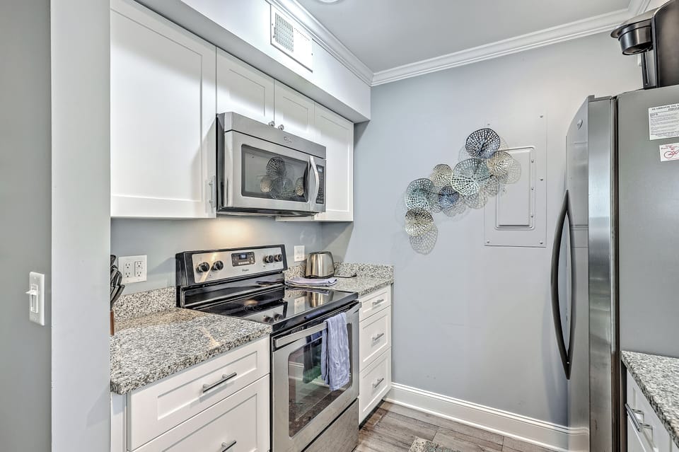 Well-stocked kitchen with ample cookware for all your culinary needs.