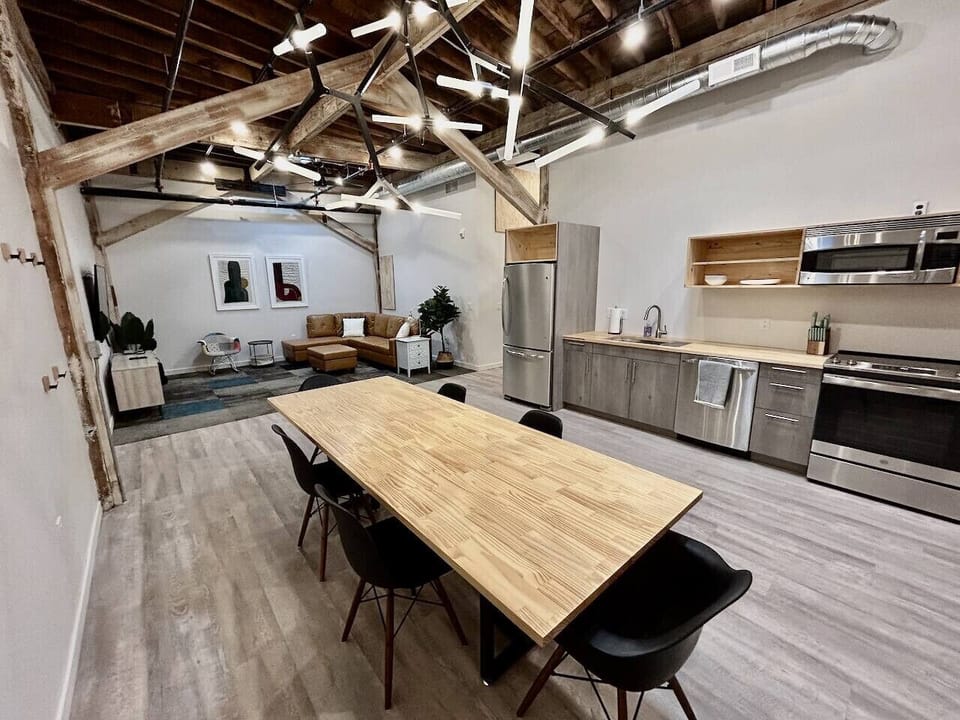 The loft features an open-plan living/dining/kitchen area. Dining table seats 6.