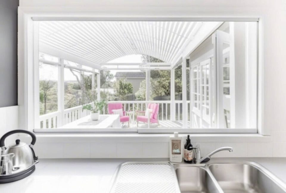 Kitchen with windows opening to the patio/deck