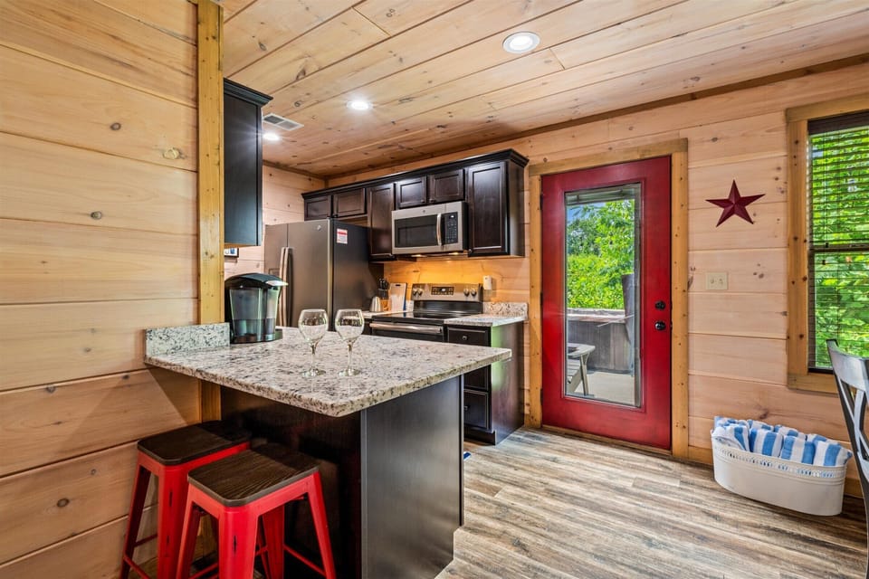 Kitchen area with seating for 2 at the counter.