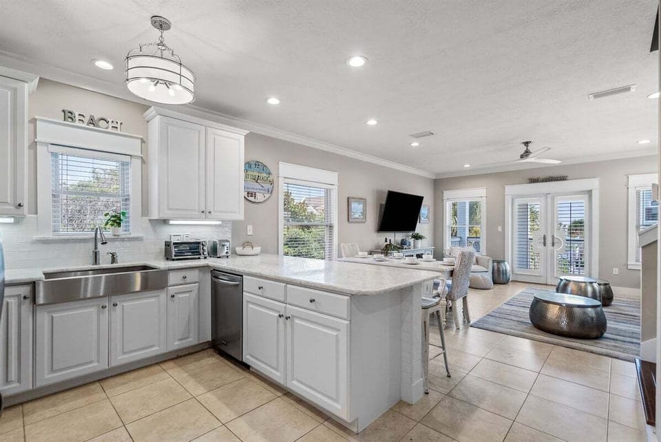 Seamless flow between cooking and lounging areas, perfect for family togetherness.