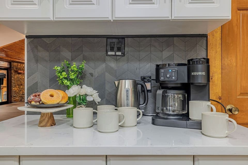 Ease into the day with a freshly brewed cup from the Keurig or drip machine, with complimentary coffee pods, tea, sugar, and creamer thoughtfully stocked for your stay.