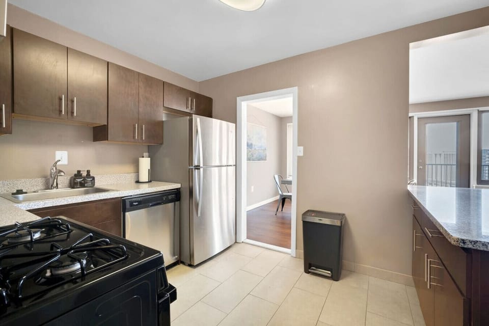 A kitchen built for real cooking, not just reheating — full-size fridge, gas range, dishwasher, and enough counter space to prep dinner for the whole group.