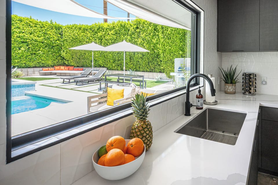 Open concept with views to the pool to be part of the fun! Wide sliders to patio