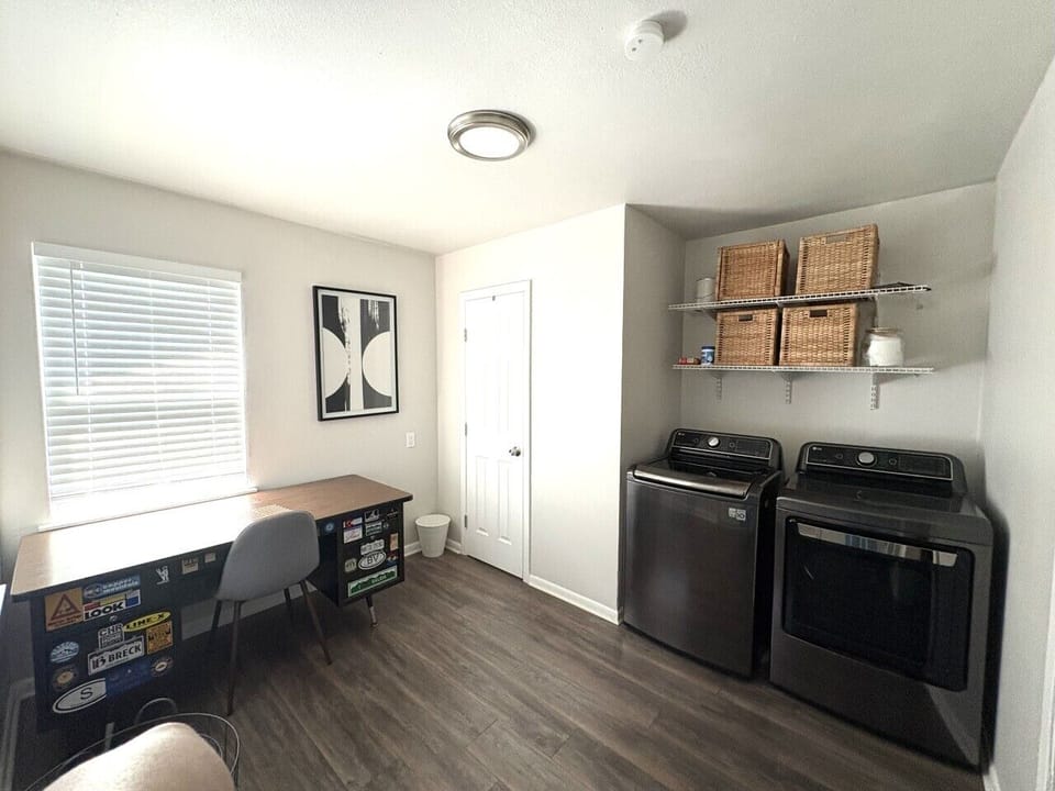 Laundry area, workspace, and half bathroom