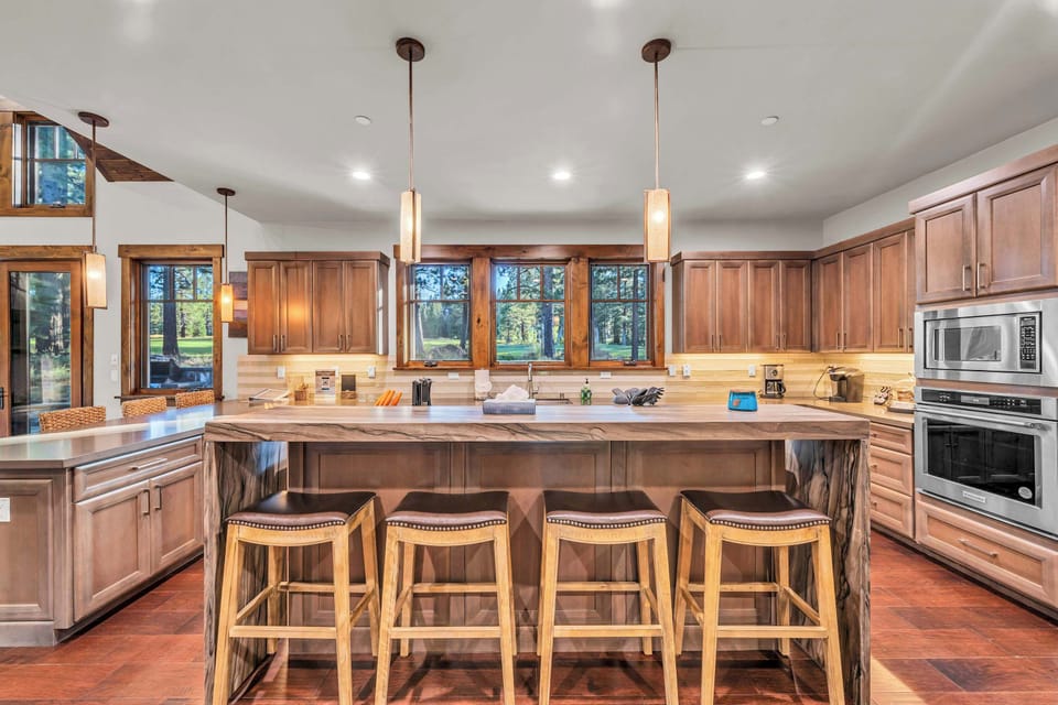 Kitchen: Main floor, drip coffee maker, Keurig, toaster, food processor, cooking utensils, tableware