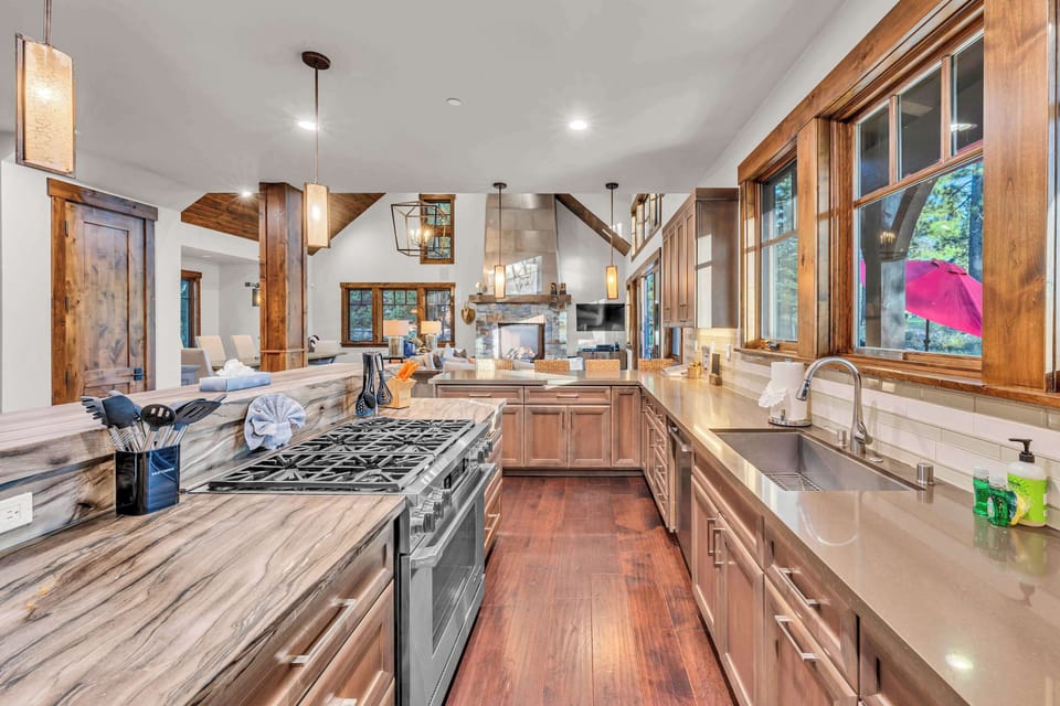Kitchen: Main floor, drip coffee maker, Keurig, toaster, food processor, cooking utensils, tableware