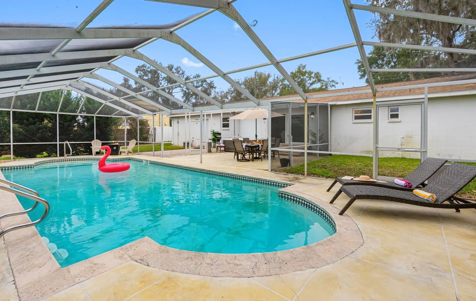 Relax in this private screened-in pool, perfect for sunny Florida days and peaceful evenings.