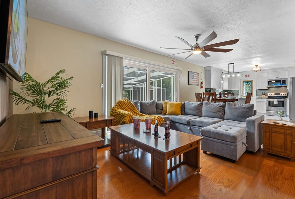 Spacious and inviting living room with plush seating, perfect for relaxing or gathering with family and friends.