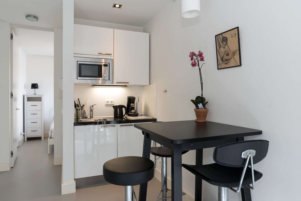 Enjoy a coffee or a glass of wine at the modern bar with stools.