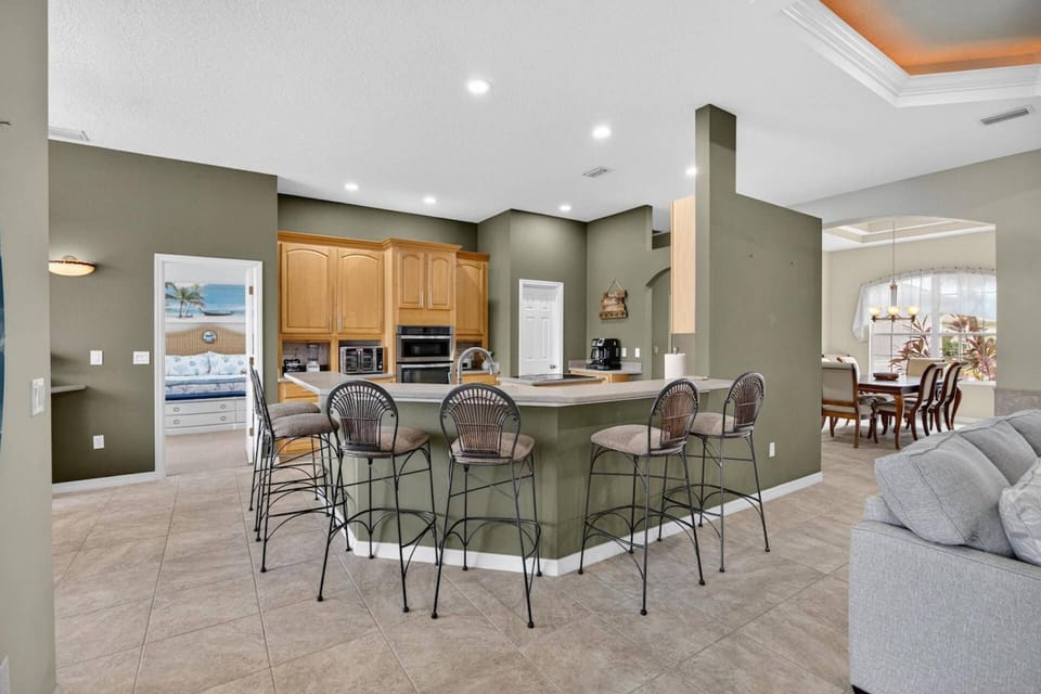 Spacious counter with seating for six — perfect for casual dining or enjoying coffee together.