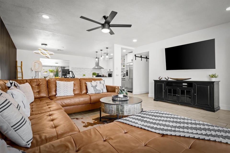 Our spacious living room features a plush leather sofa and Smart TV — the perfect setup for movie marathons, game nights, or just recharging after a day in the sun.