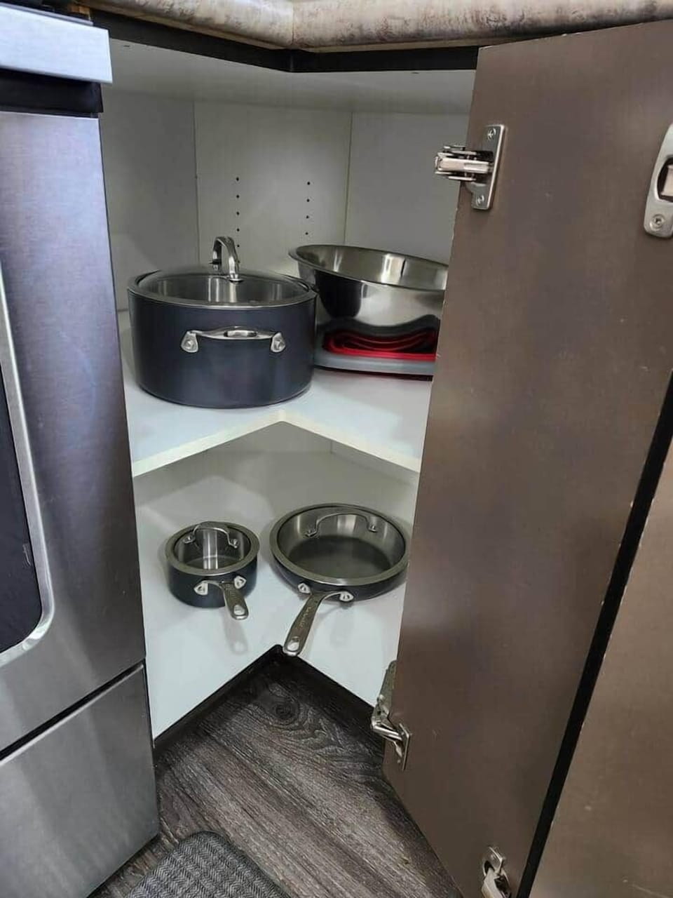 Very clean utensils stored in easily accessible drawers