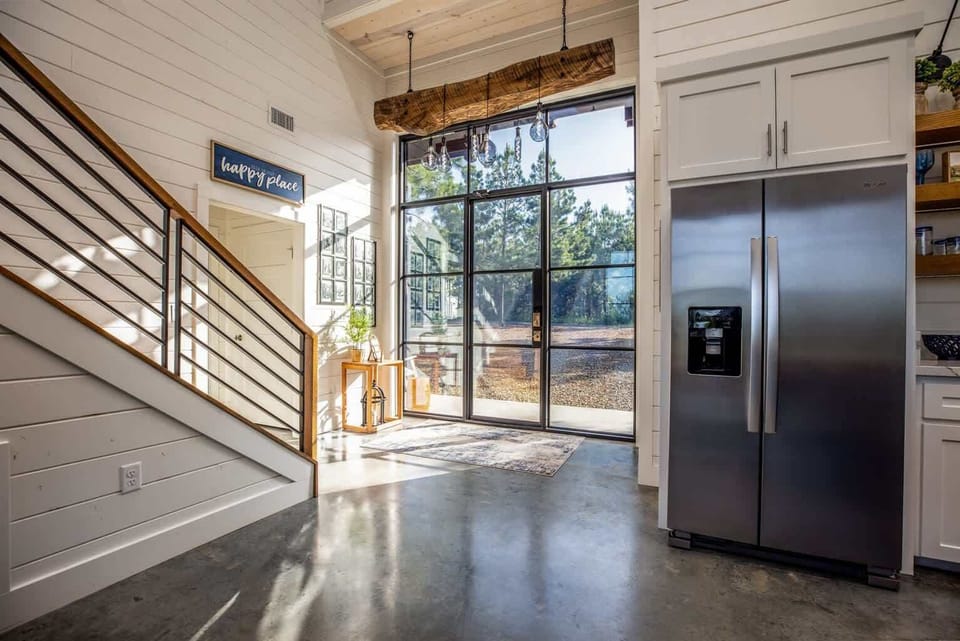 Doors that let you take in & enjoy the spectacular views that make this elegant modern barn-style cabin unique.