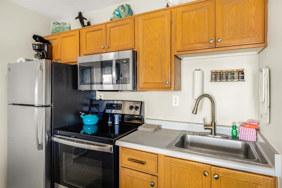 The kitchen includes full-size appliances