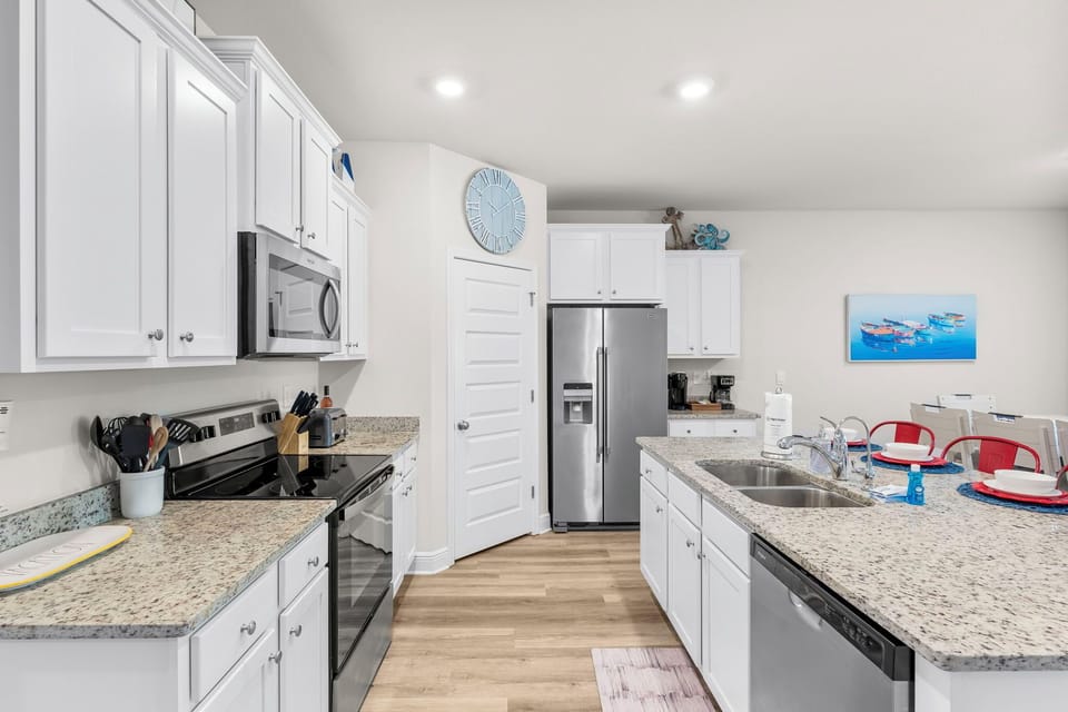 Your fully equipped kitchen awaits with granite countertops, stainless steel appliances, and everything you need to create memorable meals during your stay.