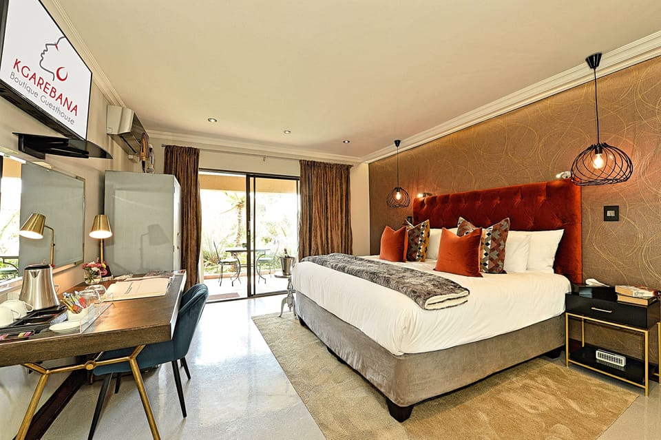 Superior Suite, 1 King Bed, Patio, Garden View | In-room safe, blackout drapes, iron/ironing board (on request)