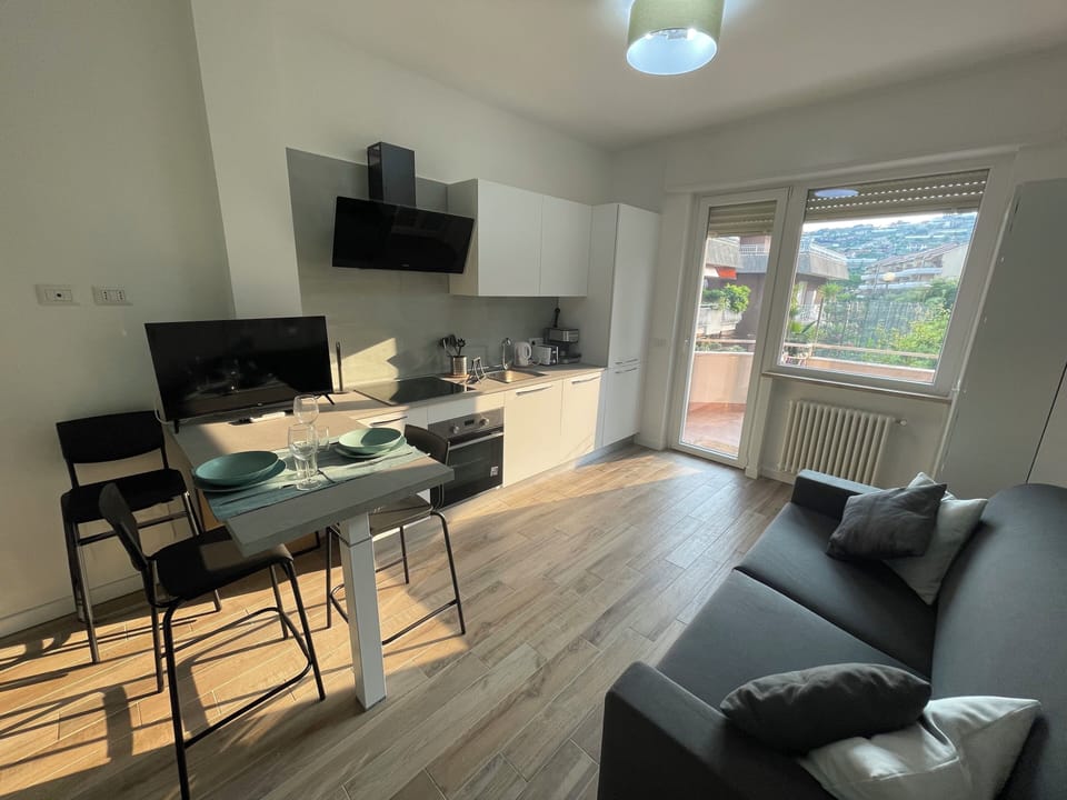 Apartment, 1 Bedroom | Living area | 30-inch TV with satellite channels