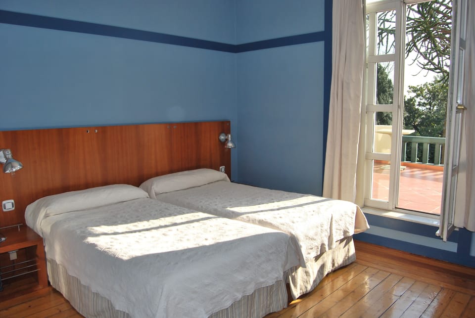Double or Twin Room | Minibar, in-room safe, desk, blackout drapes
