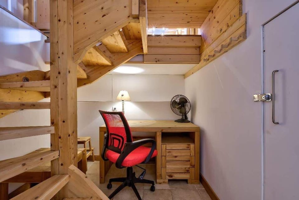 Small working station under the stairs, in the basement.