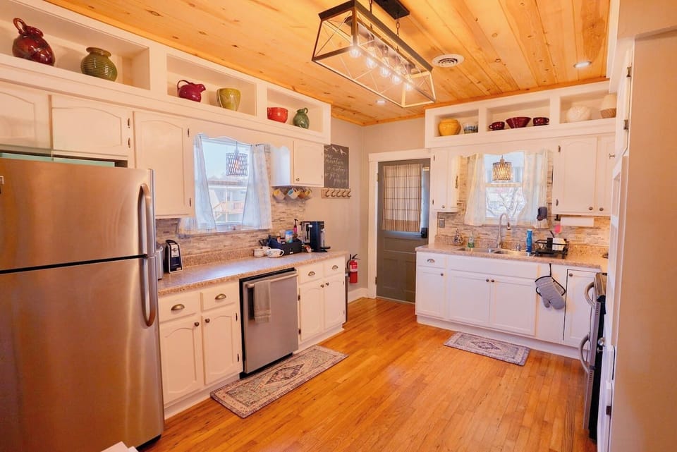 Fully stocked, family-friendly kitchen with modern appliances, plenty of counter space, and everything you need to cook meals or snacks together after a day of exploring Pigeon Forge.