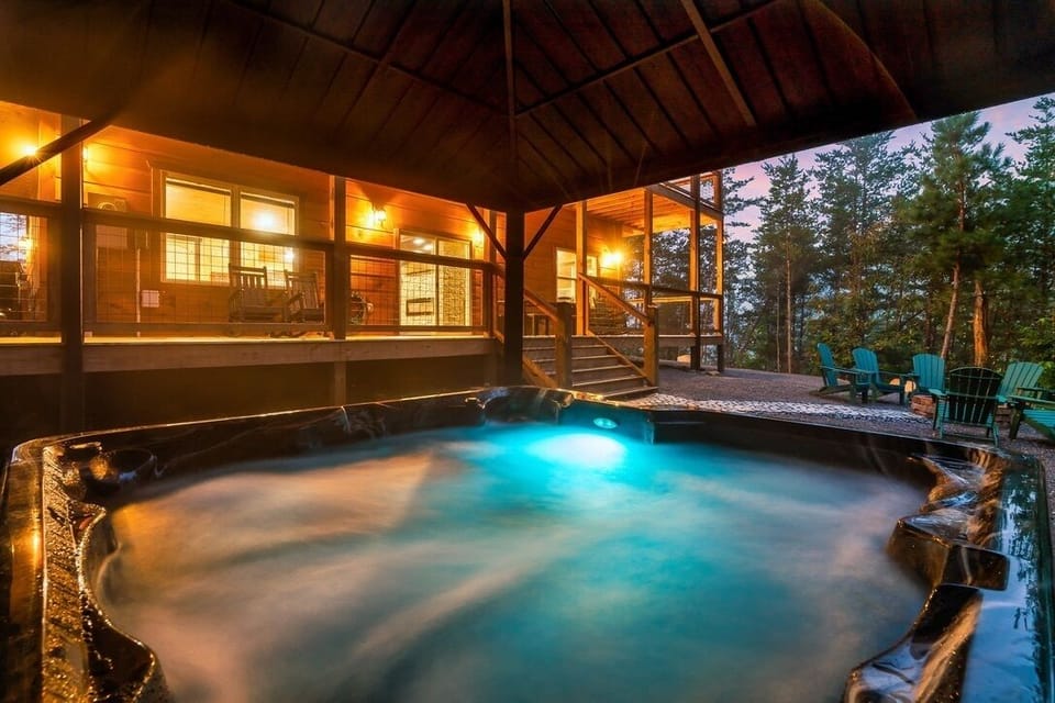 Private covered hot tub with mountain views, LED lighting, and relaxing jets
