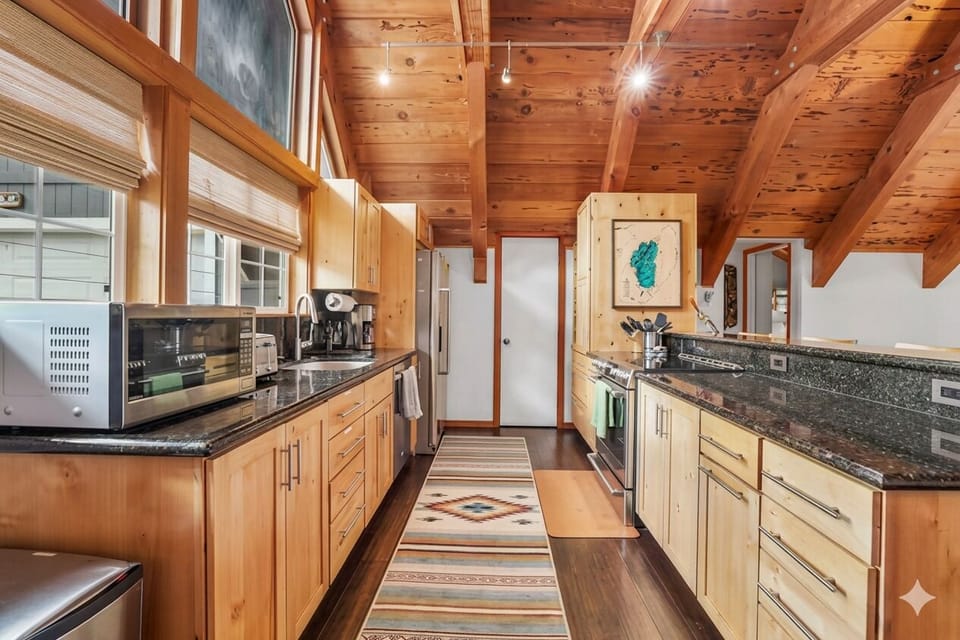 Modern rustic kitchen with updated appliances and ample counter space.
