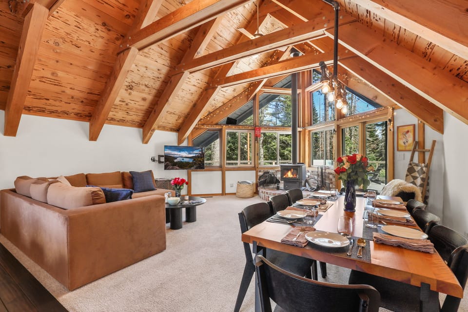Open dining and living area with high ceilings and abundant natural light.
