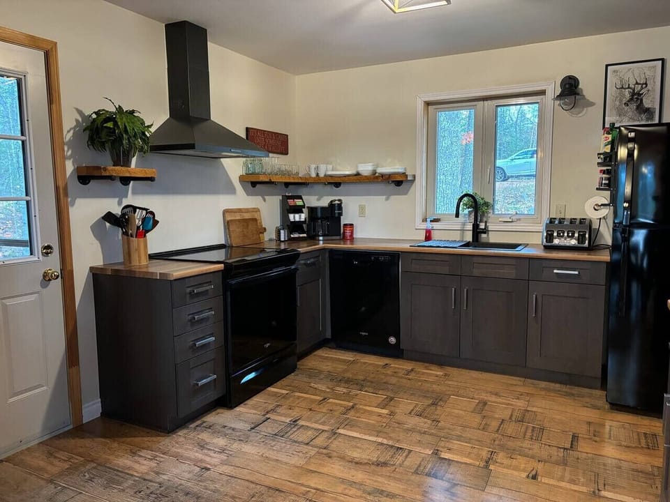 Fully equipped kitchen with stainless steel appliances, Keurig, and plenty of space to cook and gather.