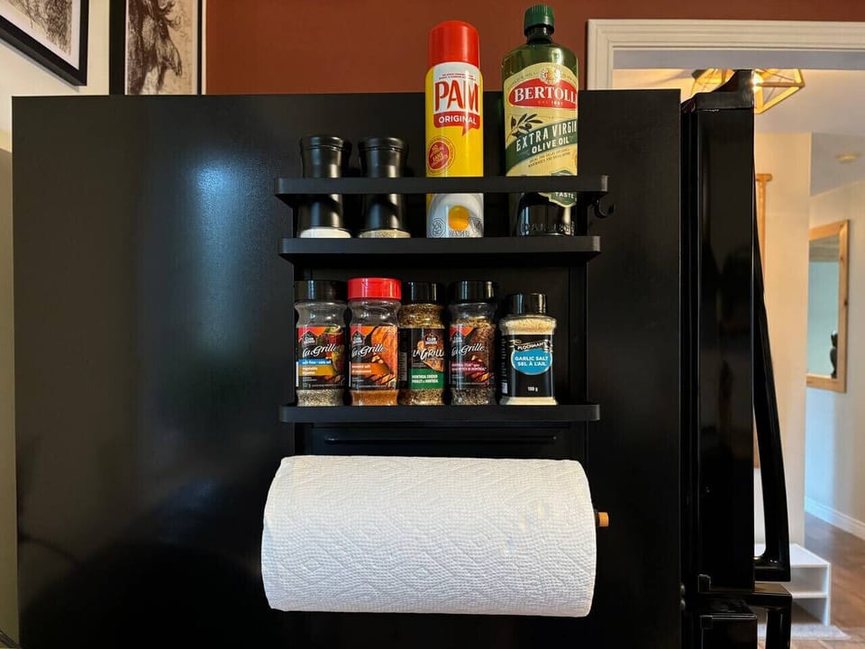 Enjoy easy access to a variety of spices with our magnetic spice rack, conveniently located on the refrigerator.