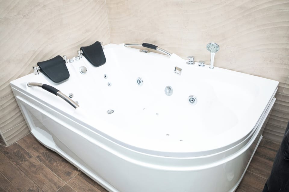 Combined shower/tub, slippers, towels, soap
