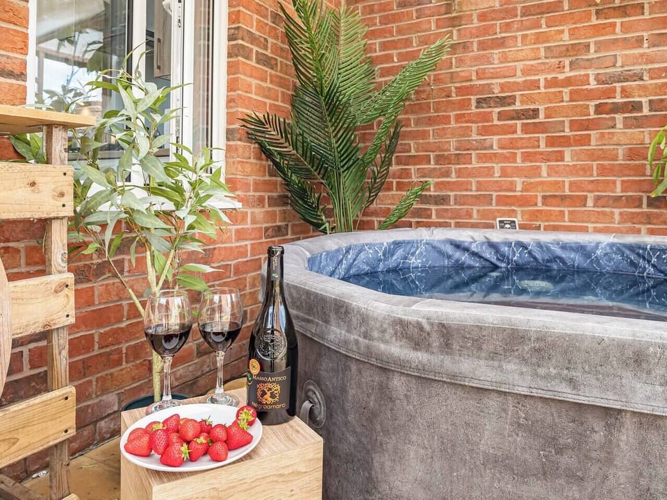 Kick back and relax in the outdoor sheltered hot tub. 