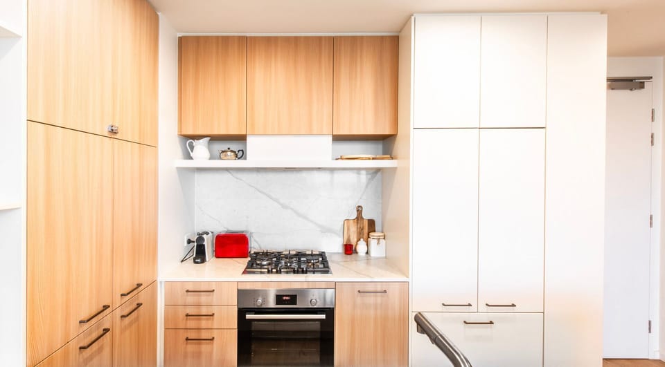 Sleek timber kitchen designed for effortless city living