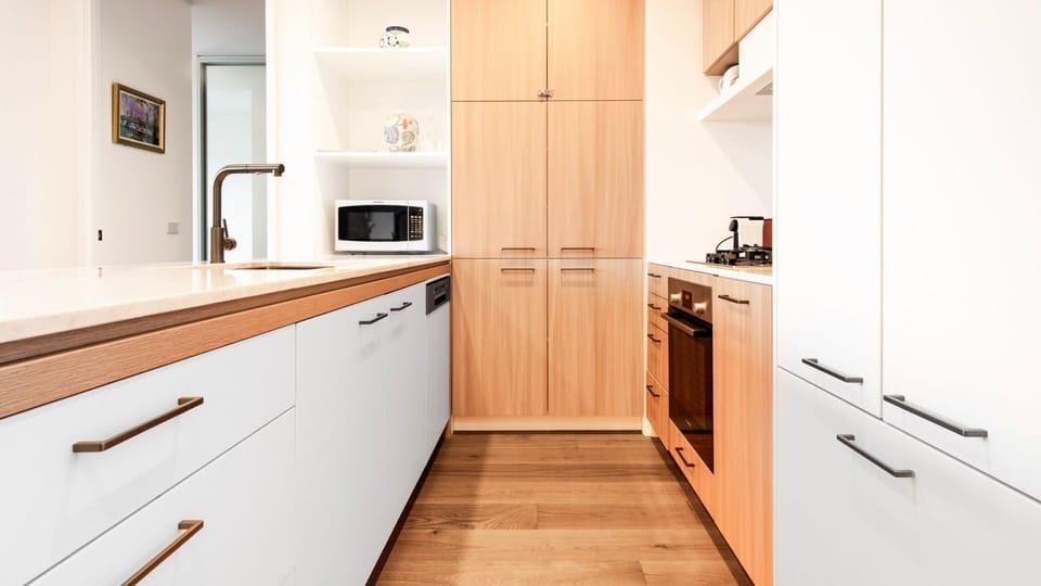 Contemporary galley kitchen with clean finishes and smart storage