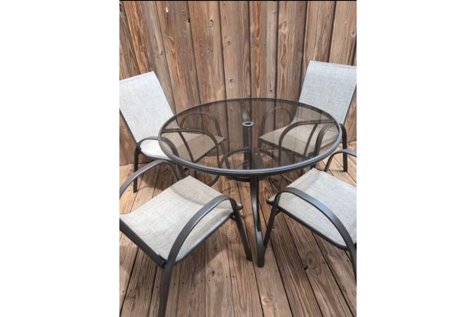 back deck with table and chairs. 