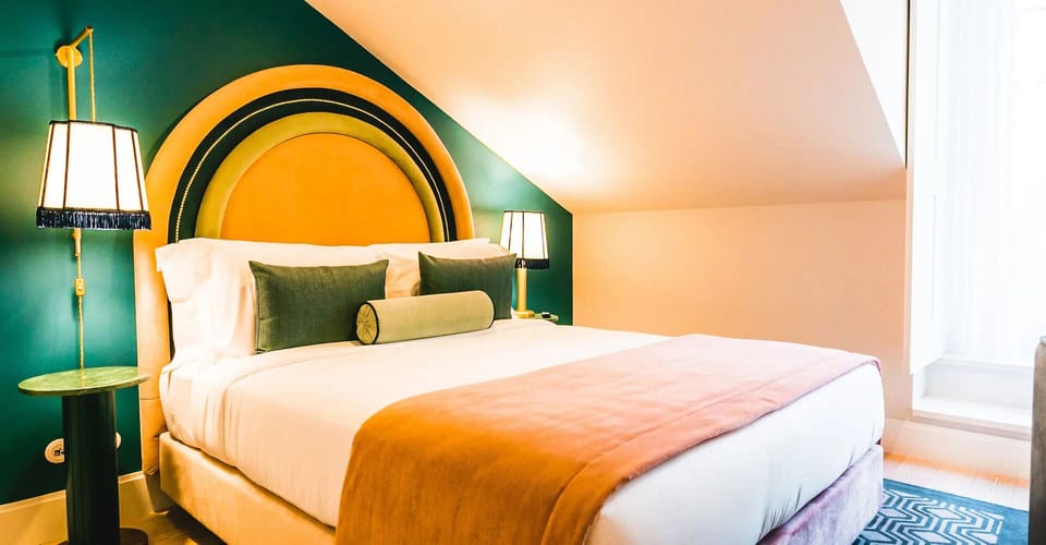 Unwind in a plush bed beneath bold, boutique design.