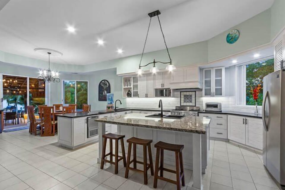 The kitchen area with the dining area in the background.