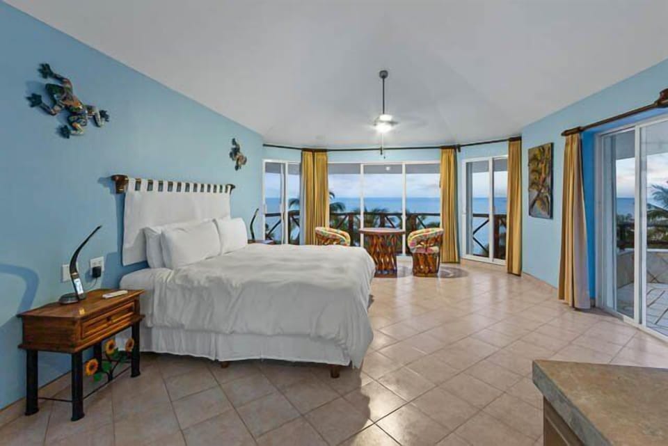 The master suite on the third level has a king size bed and a nice sitting area.