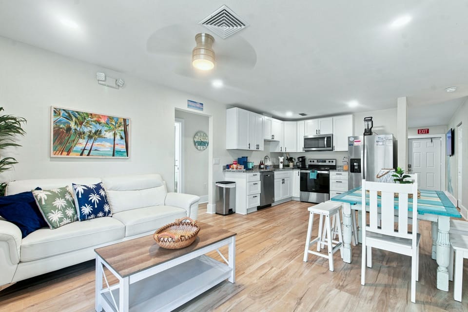 Tons of seating options in the living room that flows into the kitchen