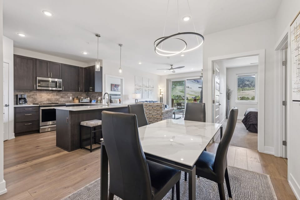 Dining room with table and seating for 4 people.