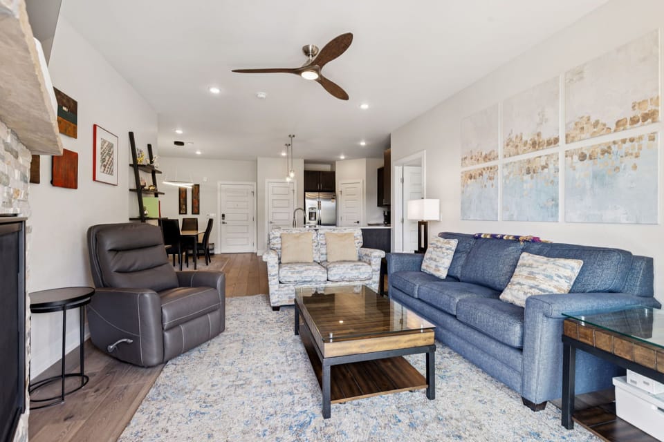 Spacious living area with gas fireplace and smart TV.